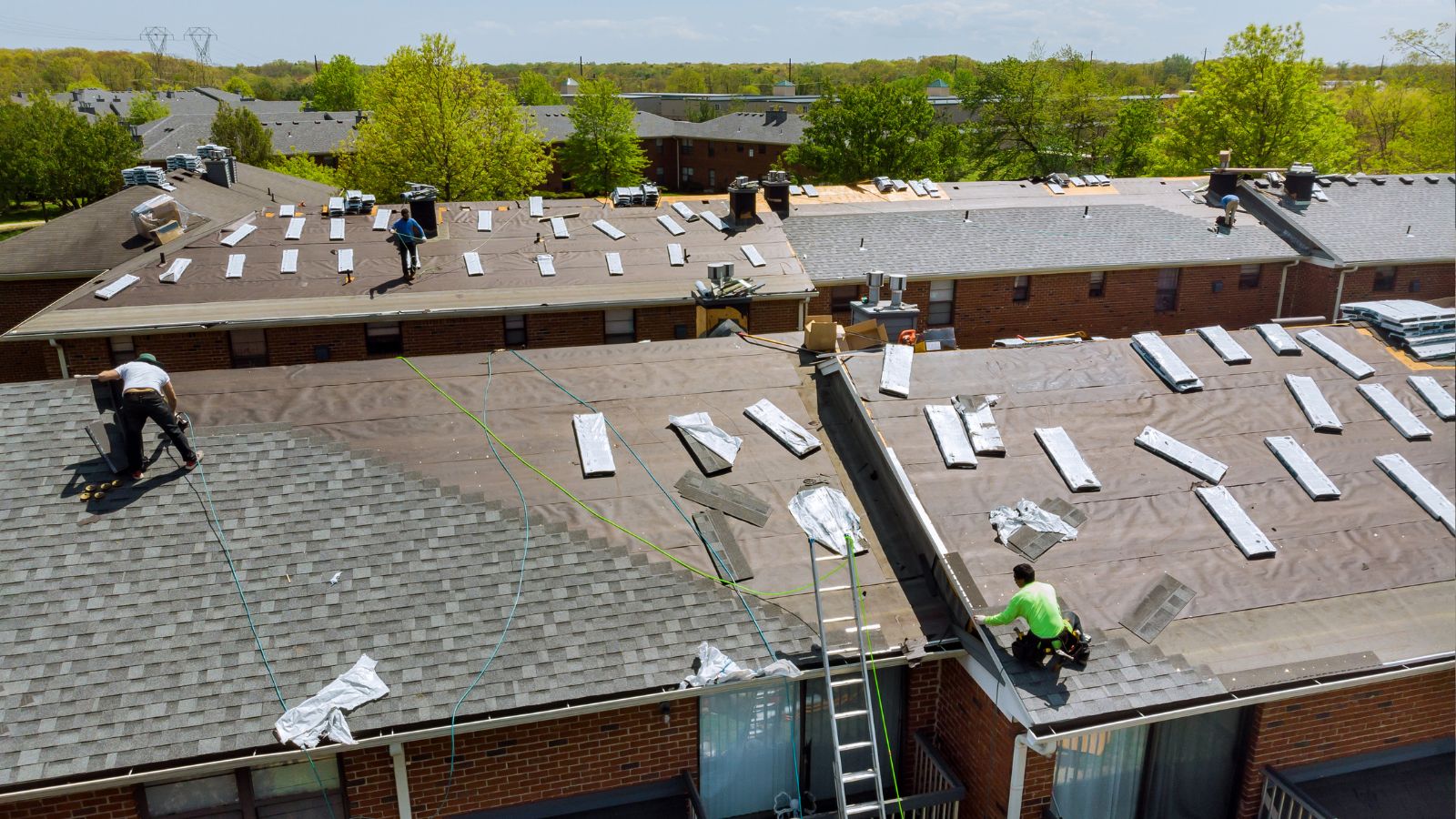 Technician repairing a flat roof